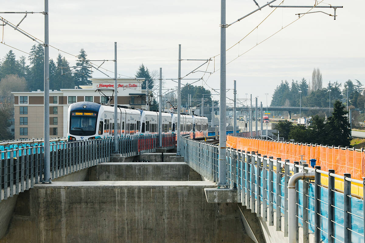 Northgate Station during testing prior to opening. Light rain vehicles on the guideway and at platform. January 20, 2021.