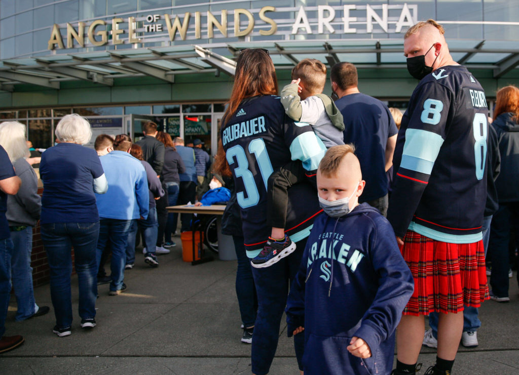 Fans wait in line to enter Everett’s Angel of the Winds Arena for the pre-season game between the Kraken and the Oilers on Friday. (Kevin Clark / The Herald)
