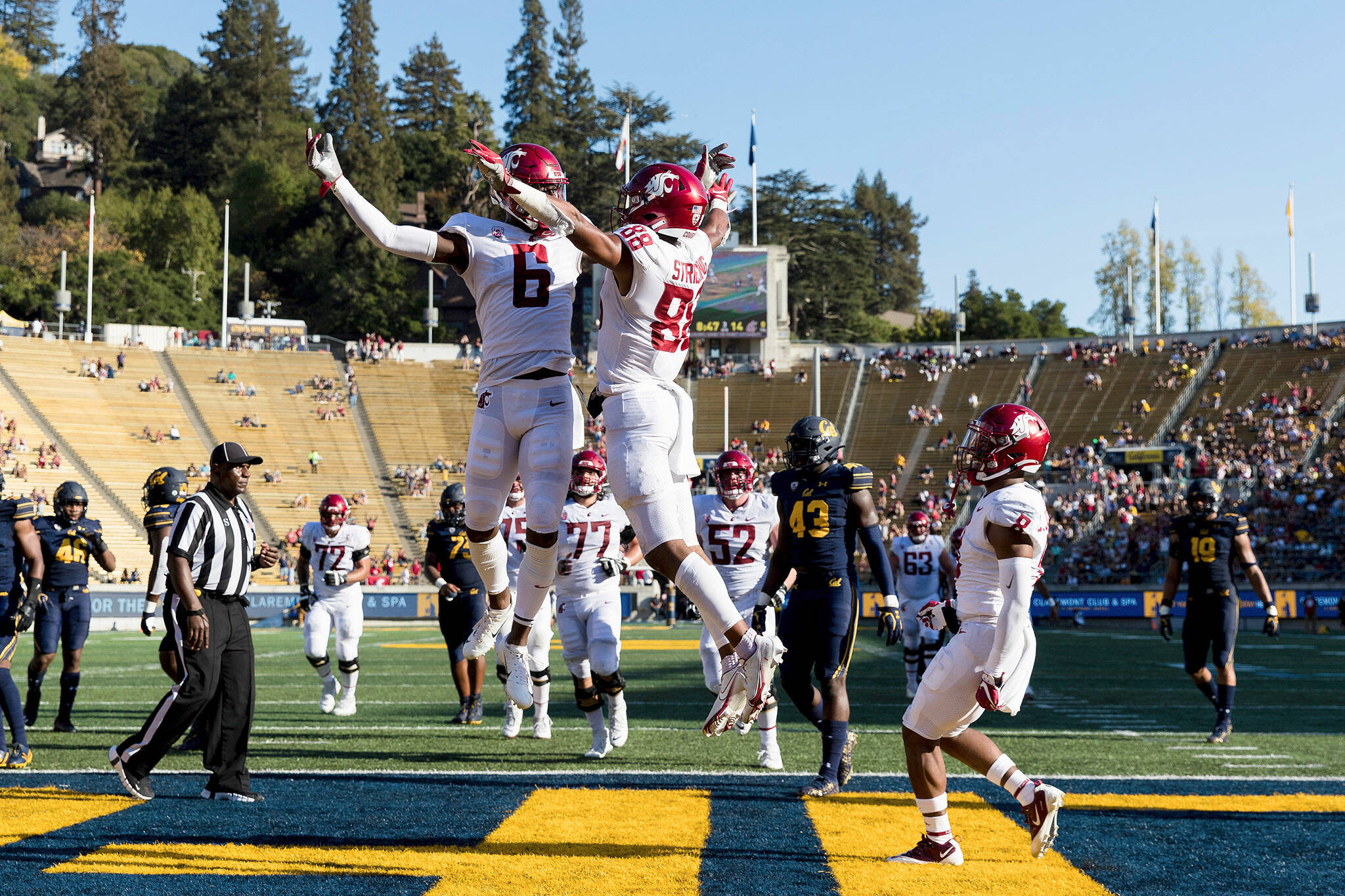 Washington State wide receiver De’Zhaun Stribling (right) celebrates Donovan Ollie after scoring a touchdown against California in the third quarter of a game Saturday in Berkeley, Calif. (AP Photo/John Hefti)
