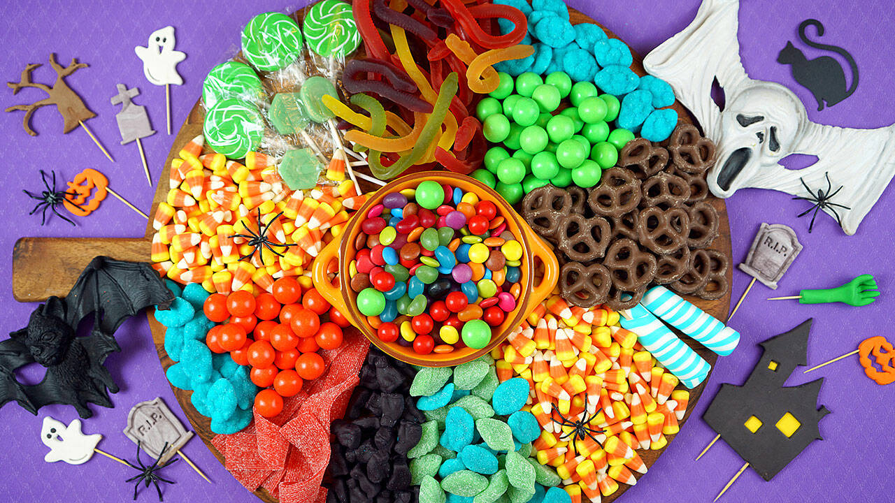 A Halloween charcuterie board with candy and chocolate-covered pretzels. Amateur chefs are redefining the term charcuterie itself, adding novel ingredients to their creations. (Getty Images)