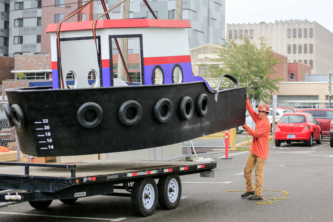 A model tugboat exhibit is placed in the expansion construction of the Imagine Children's Museum Monday afternoon in Everett on September 27, 2021.  (Kevin Clark / The Herald)