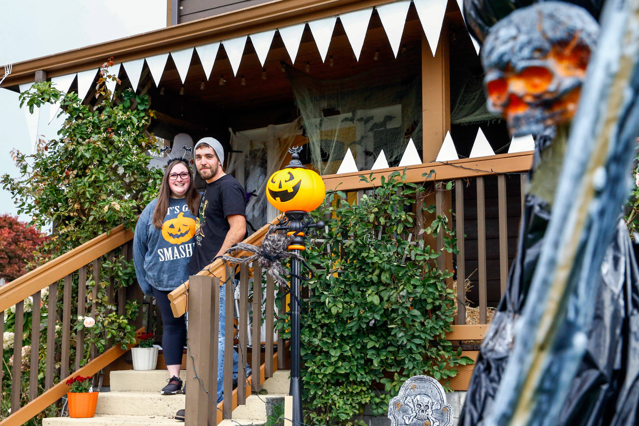 Cameo and Nick Beedle at their Halloween-themed home in Everett. (Kevin Clark / The Herald)