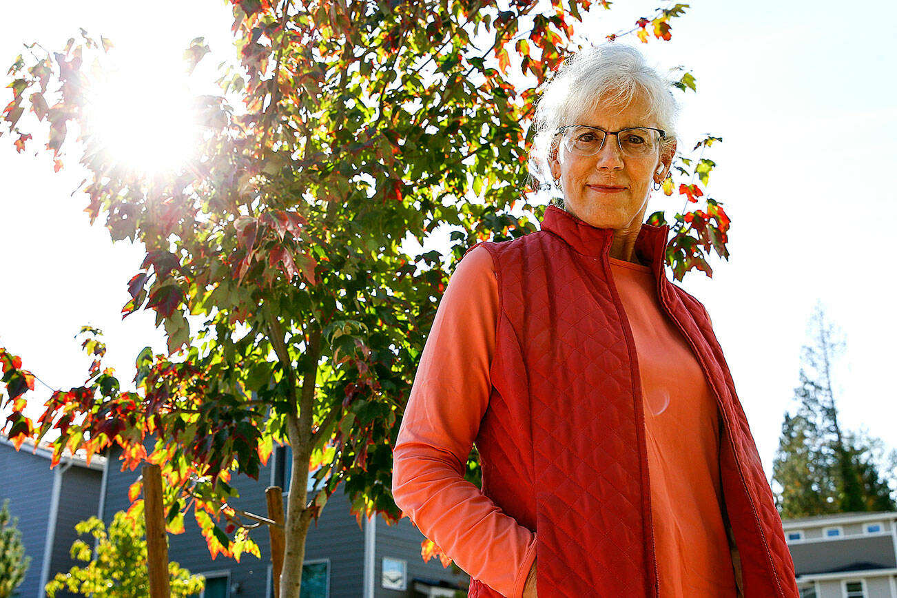 Kate Lunceford has complaints of the use and treatments of trees in new construction in Bothell on October 7, 2021. (Kevin Clark / The Herald)