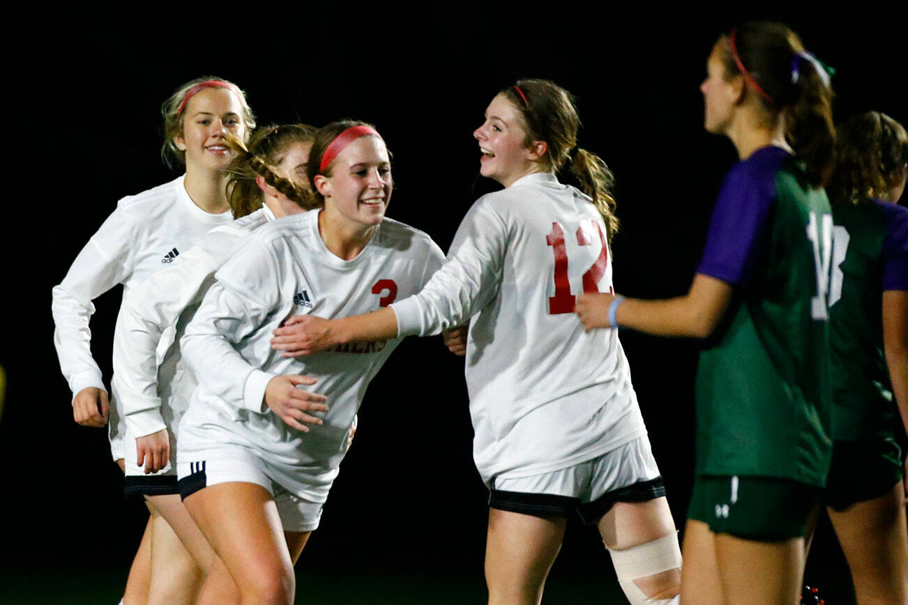 Snohomish celebrates a goal by Snohomish's Sara Rodgers (3) Thursday night at Edmonds-Woodway High School in Edmonds on October 7, 2021. (Kevin Clark / The Herald)