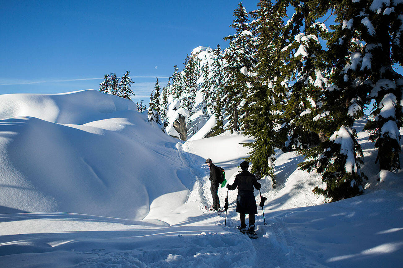 Don Sarver, left, and Kyle James, right, snowshoe on the Skyline Lake Trail on Saturday, Jan. 26, 2019 in Leavenworth, Wa. (Olivia Vanni / The Herald)
Don Sarver, left, and Kyle James, right, snowshoe on the Skyline Lake Trail on Jan. 26, 2019, in Leavenworth. (Olivia Vanni / Herald file)