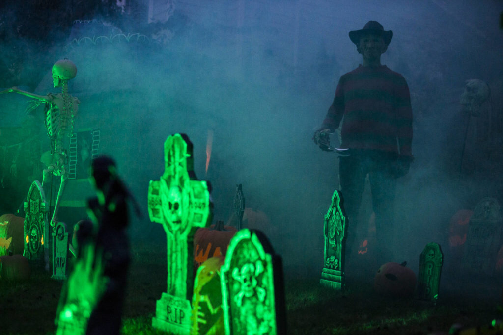 Michael Smith, dressed as Freddy Krueger, wanders through a Halloween scene Saturday in Arlington. (Olivia Vanni / The Herald)
