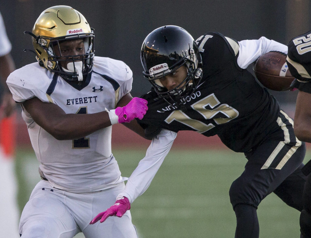 Everett’s Jemyre Reed grabs Lynnwood’s Andrew Archide by the jersey during a game on Friday in Edmonds. (Olivia Vanni / The Herald)
