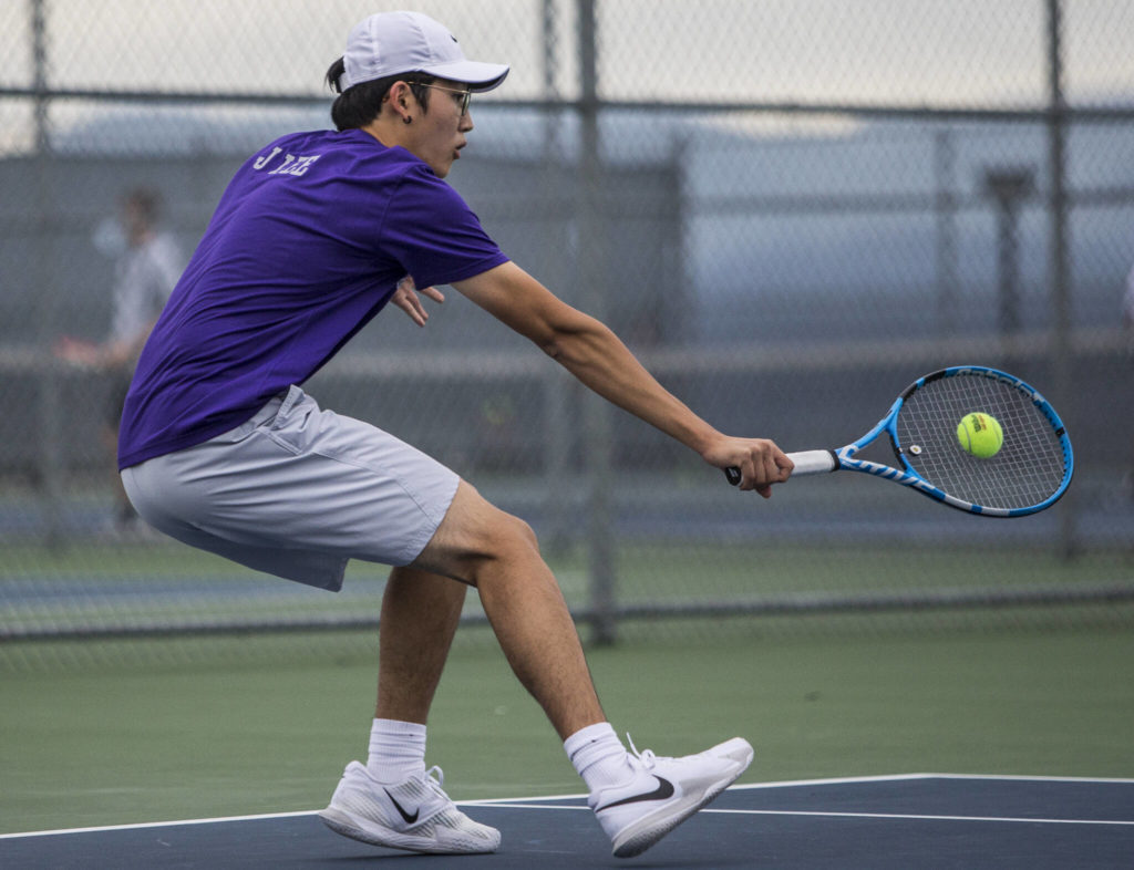 Kamiak’s Josh Kim returns a volley during a match against Glacier Peak’s Jason Yee at Glacier Peak High School on Tuesday, Oct. 12, 2021 in Snohomish, Wa. (Olivia Vanni / The Herald)
