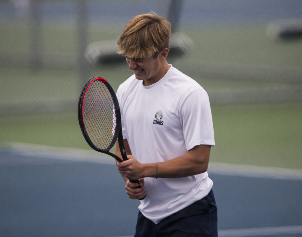 Glacier Peak’s Nathan Simicich reacts to returning a volley out of bounds during a double match against Kamiak at Glacier Peak High School on Tuesday, Oct. 12, 2021 in Snohomish, Wa. (Olivia Vanni / The Herald)
