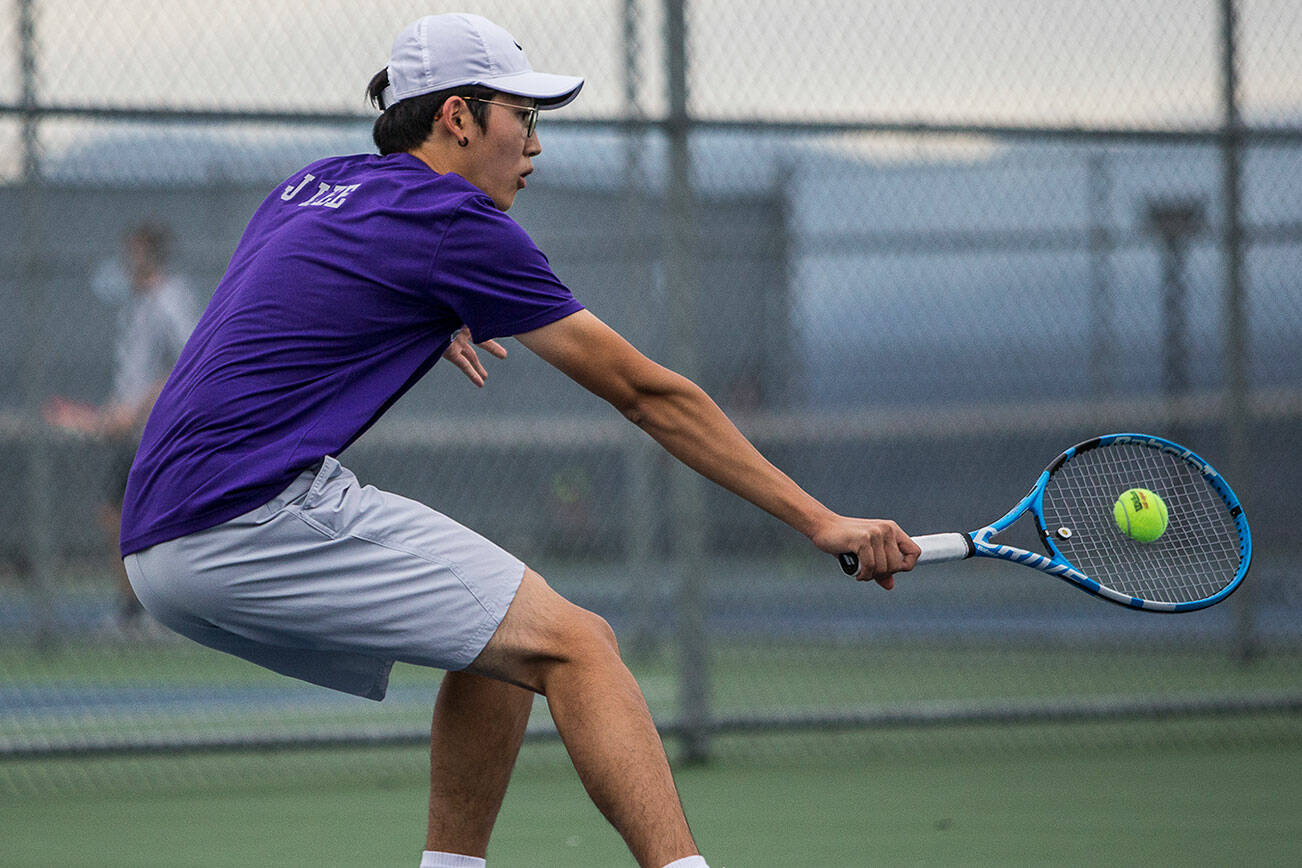 Kamiak's Josh Kim returns a volley during a match against Glacier Peak's Jason Yee at Glacier Peak High School on Tuesday, Oct. 12, 2021 in Snohomish, Wa. (Olivia Vanni / The Herald)