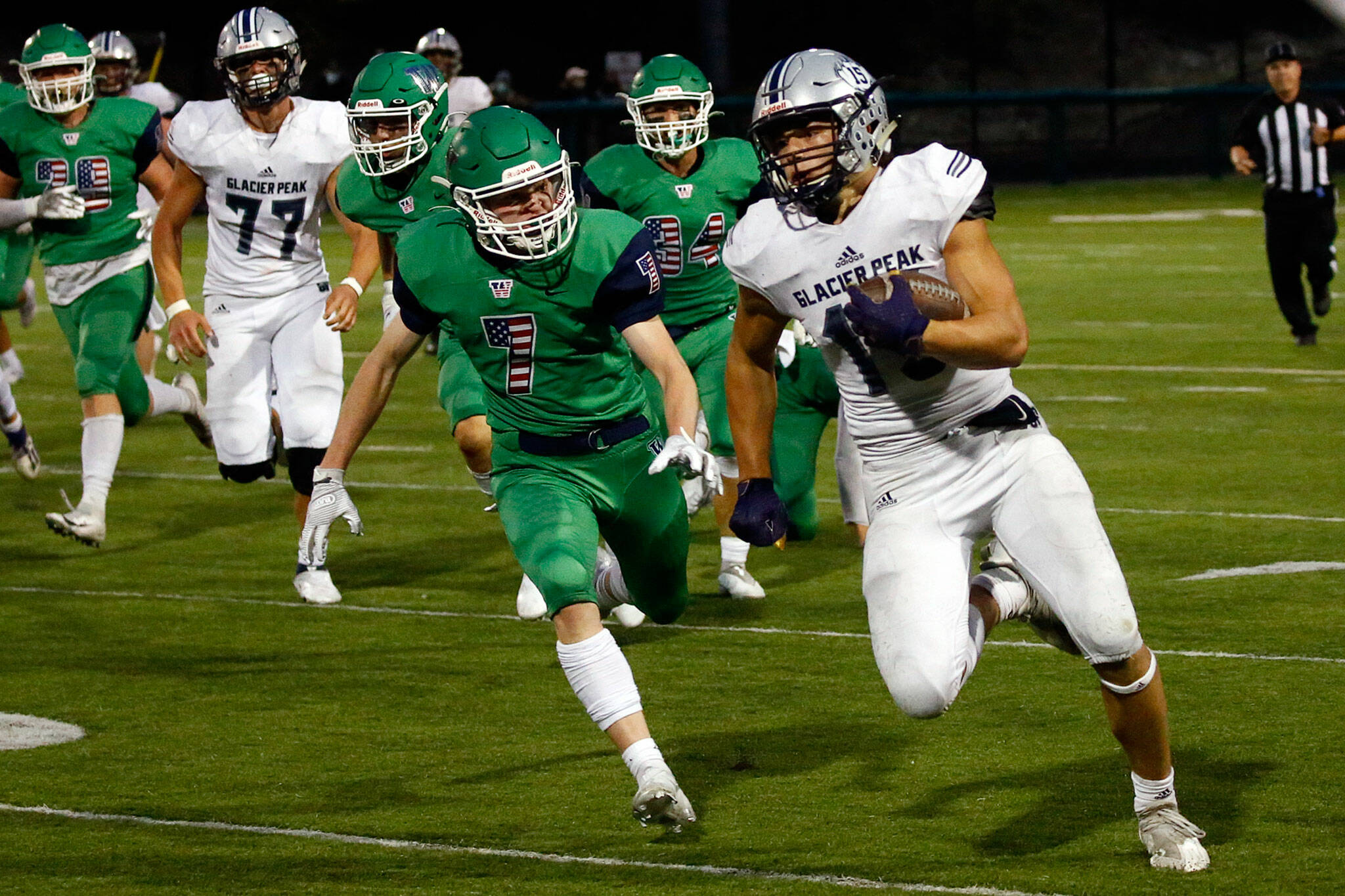 Glacier Peak’s Trey Leckner (right) rushes for a touchdown during a game against Woodinville on Sept. 16, 2021, at Pop Keeney Stadium in Bothell. (Kevin Clark / The Herald)