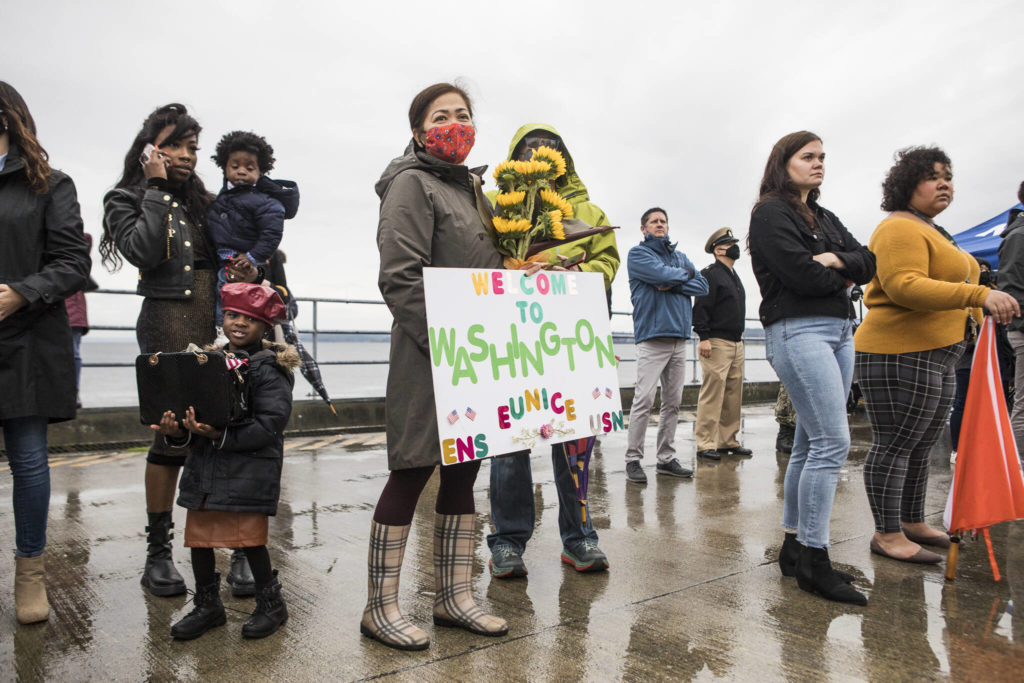 Families and friends of sailors gather to welcome the USS John S. McCain on Friday in Everett. (Olivia Vanni / The Herald)
