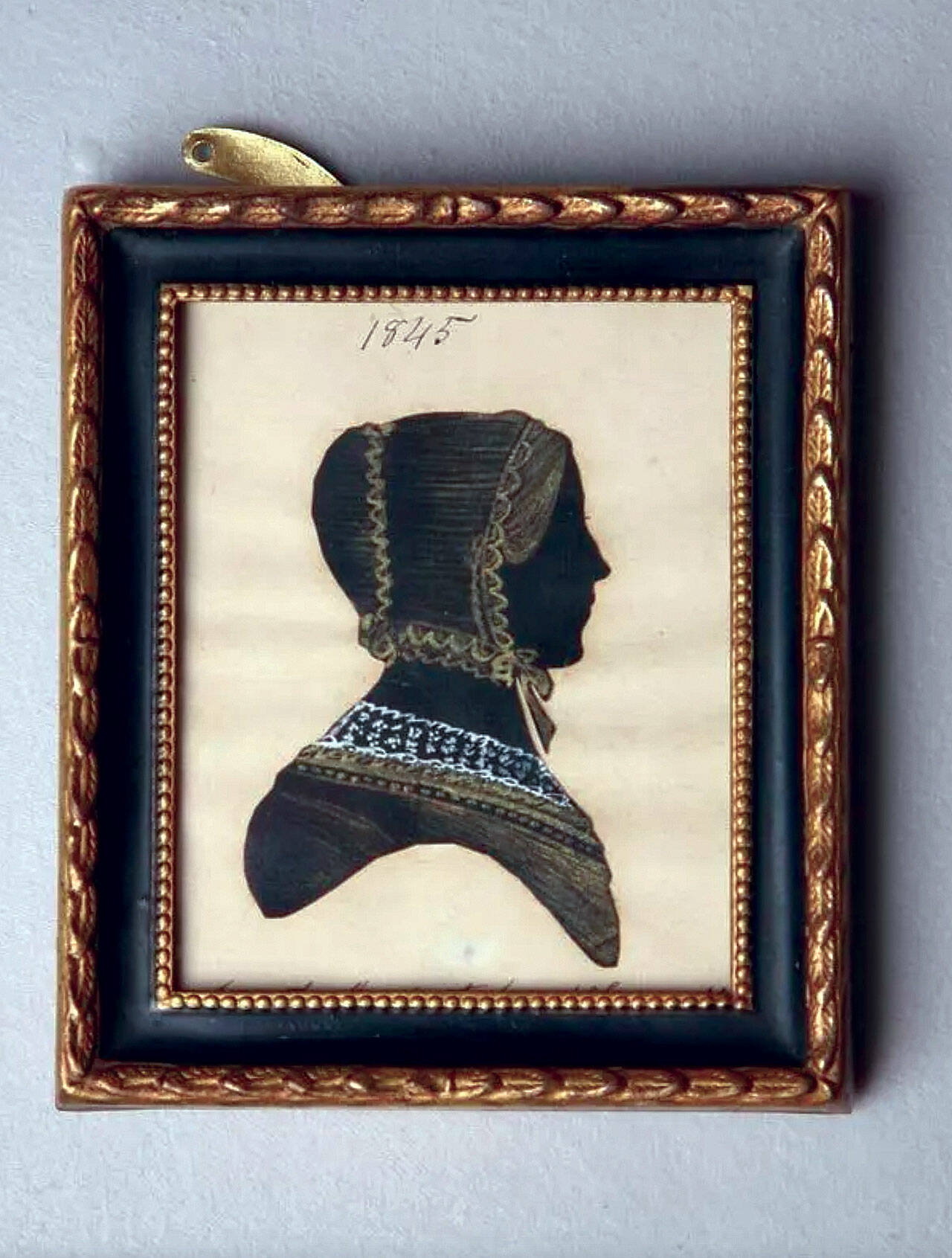 This silhouette of a woman, cut by mouth by Martha Ann Honeywell, had an estimated value of $400 to $800 at Garth’s Auction, Inc., but did not sell. (Cowles Syndicate Inc.)