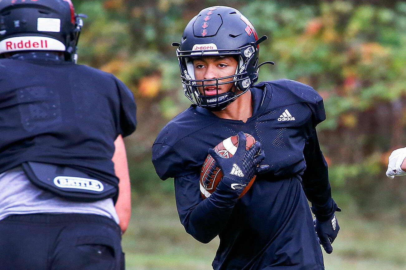 Jelani Guerrero returns an interception during practice Thursday afternoon at Archbishop Murphy High School in Everett on October 14, 2021.  (Kevin Clark / The Herald)