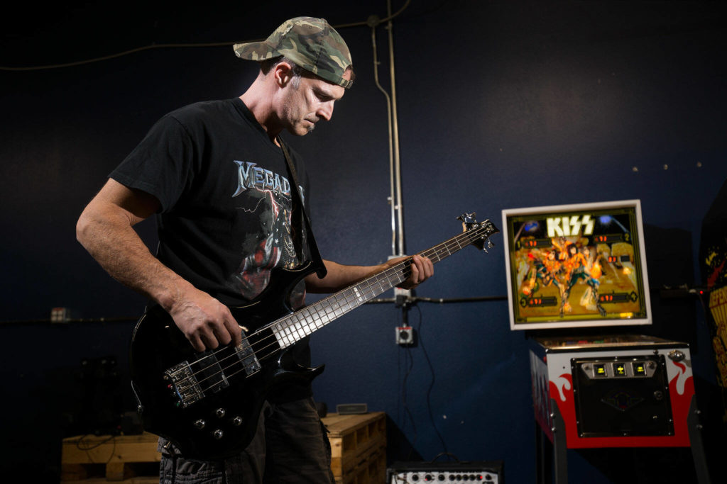 Gene Simmons impersonator Jack Murrin rehearses for the 90-minute Kiss concert he will perform in front of his north Everett home on Halloween. (Andy Bronson / The Herald)
