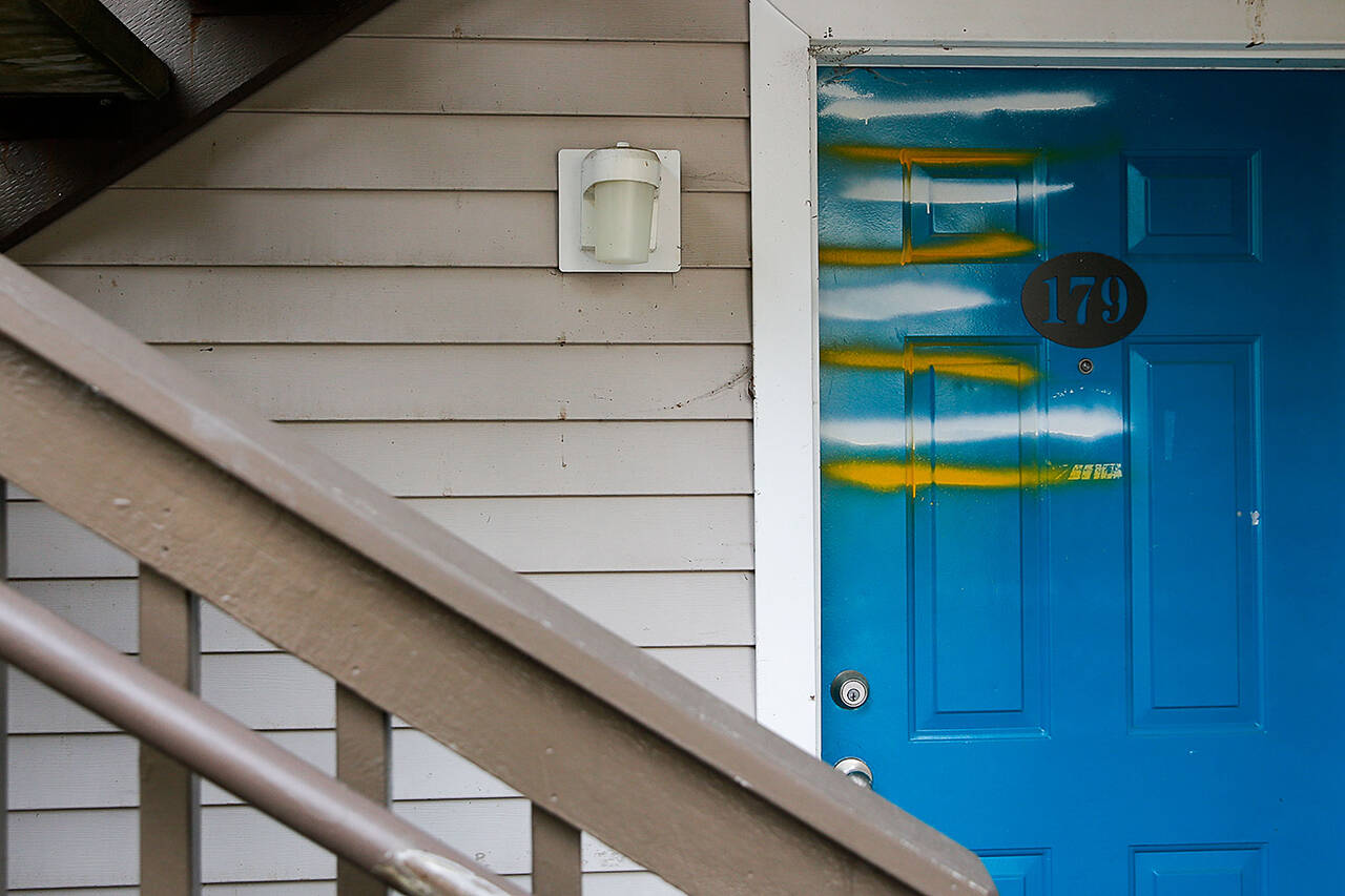 Empty apartments doors are marked at the Whispering Pines Complex in Lynnwood on Aug. 25. (Kevin Clark / Herald file)
