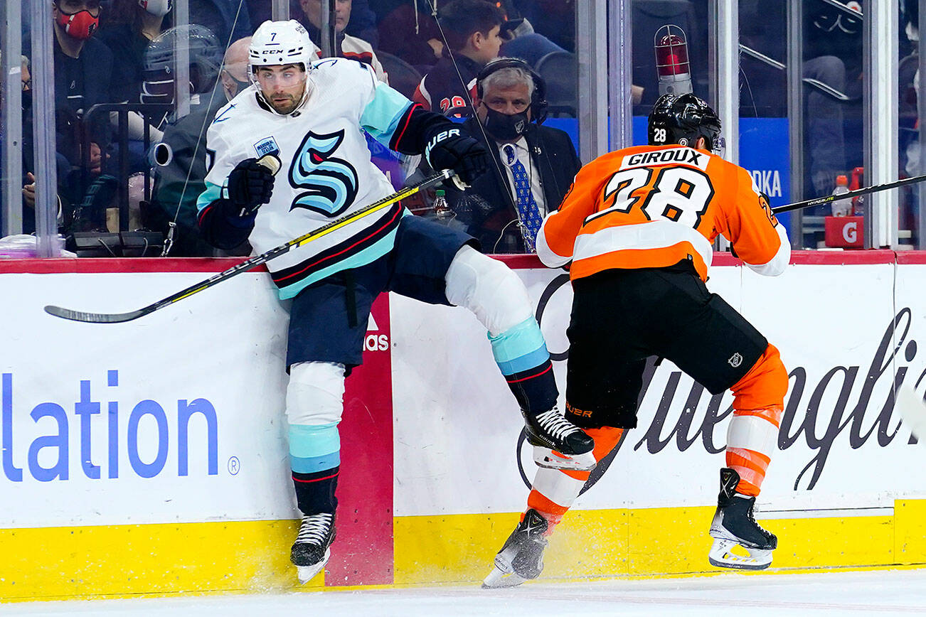 Seattle Kraken's Jordan Eberle, left, and Philadelphia Flyers' Claude Giroux collide during the first period of an NHL hockey game, Monday, Oct. 18, 2021, in Philadelphia. (AP Photo/Matt Slocum)