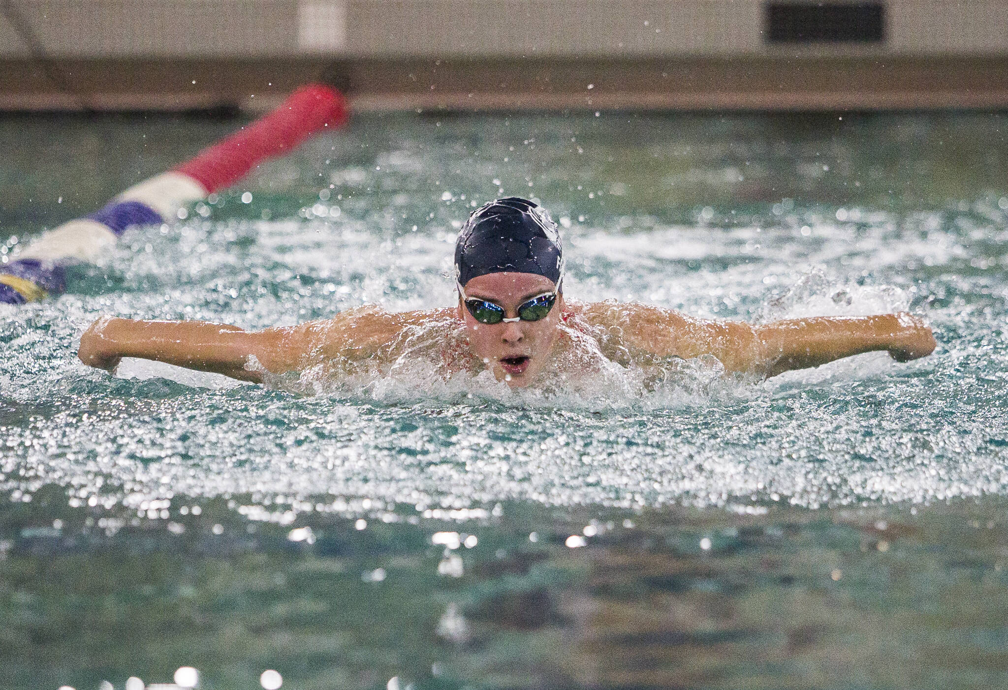 Macy Fidler helped lead Glacier Peak past Snohomish on Tuesday in the first-ever head-to-head meeting between the crosstown girls swimming programs. With the victory, the Grizzlies clinched the Wesco North title and completed an undefeated regular season. (Olivia Vanni / The Herald)