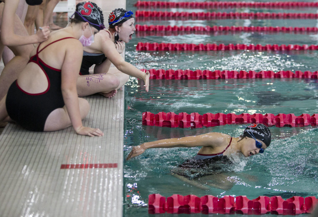 Snohomish’s Cal Misner cheers on teammate Mia Limmer-Lai. (Olivia Vanni / The Herald)
