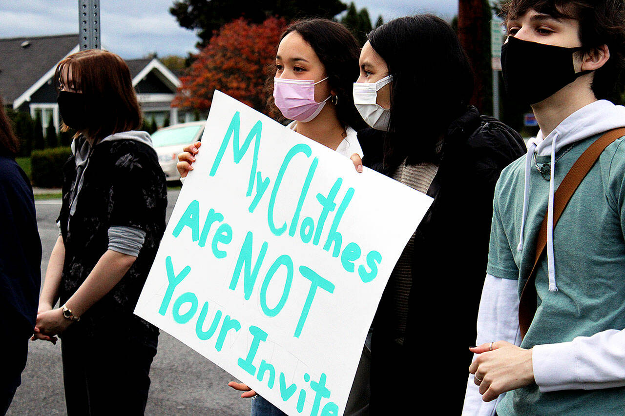 Snohomish School District students demonstrated in front of Snohomish High School Friday morning to protest sexual misconduct after a high school student said she was forcibly kissed in a hallway. (Isabella Breda / The Herald)