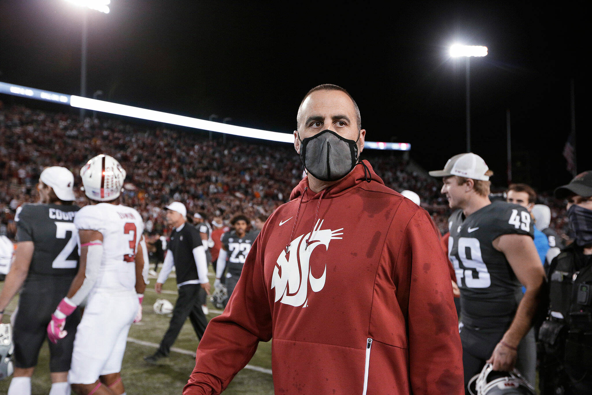 Former Washington State coach Nick Rolovich walks on the field after the team’s game against Stanford on Oct. 16, 2021, in Pullman. (AP Photo/Young Kwak)