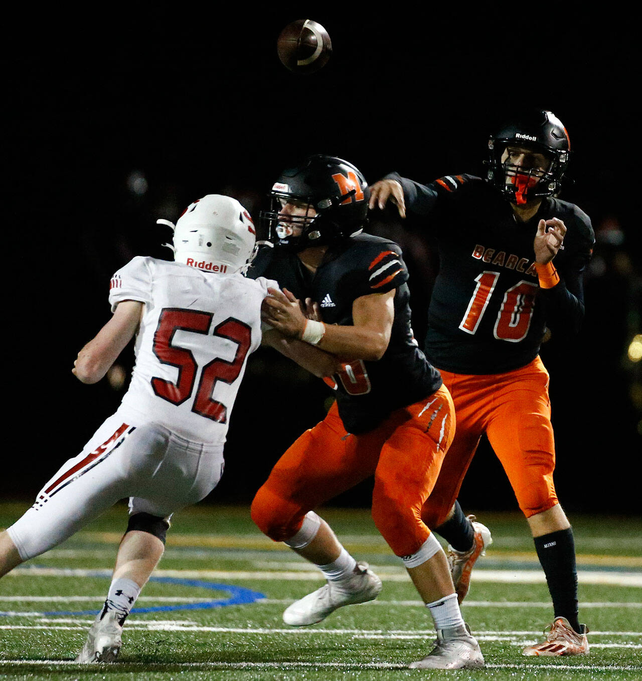 Monroe quarterback Blake Springer helped lead the Bearcats to a wild 42-40 overtime win over Snohomish on Friday night. Monroe clinched a share of the Wesco 3A South title with the victory. (Kevin Clark / The Herald)