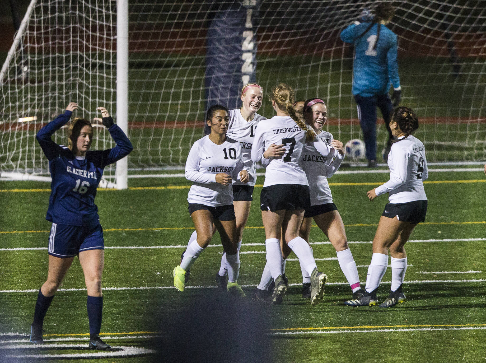 Jackson players react to one of teammate Kaeden Hansen’s two goals during their 2-1 win over Glacier Peak on Tuesday night. The Timberwolves claimed a share of the Wesco 4A title with the victory. (Olivia Vanni / The Herald)