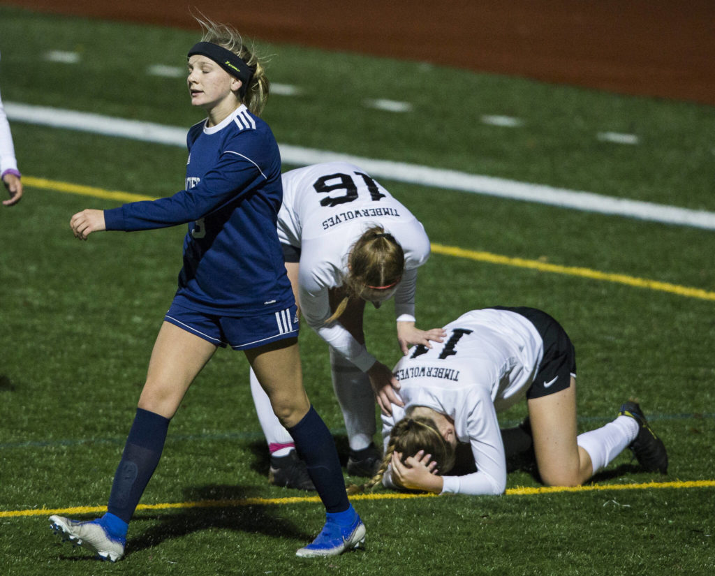 Glacier Peak’s Chloe Seelhoff walks away from Jackson’s Haley McCoy after fouling her during the game Tuesday in Snohomish. (Olivia Vanni / The Herald)
