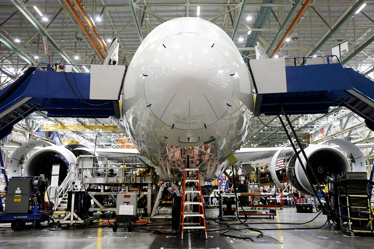 Employees work on a Boeing 787 Dreamliner during final assembly of the airplane at the Boeing factory in Everett on May 28, 2013. (Patrick T. Fallon/Bloomberg, file)