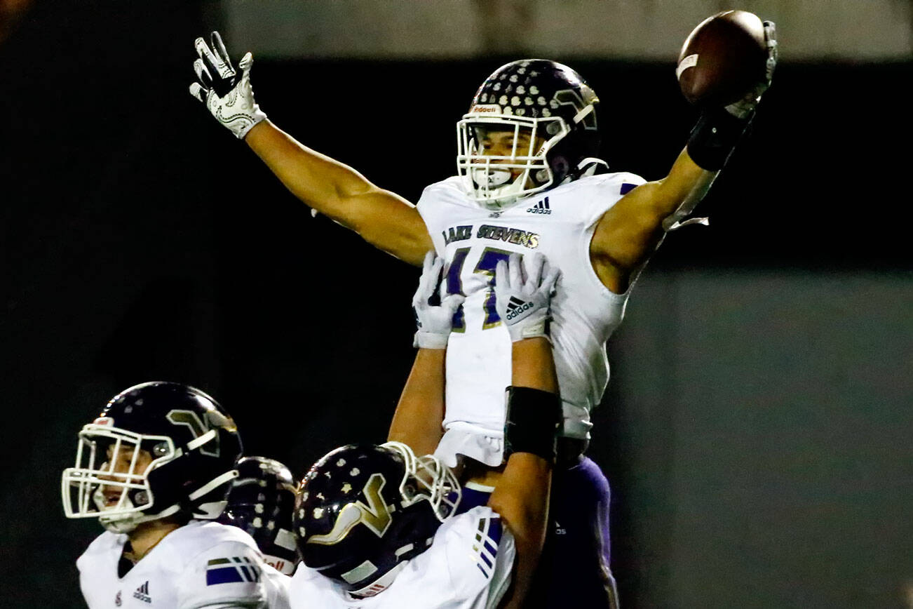Lake Stevens' Jayden Limar celebrates a touchdown at Veterans Memorial Stadium Friday night in Snohomish on October 29, 2021. (Kevin Clark / The Herald)
