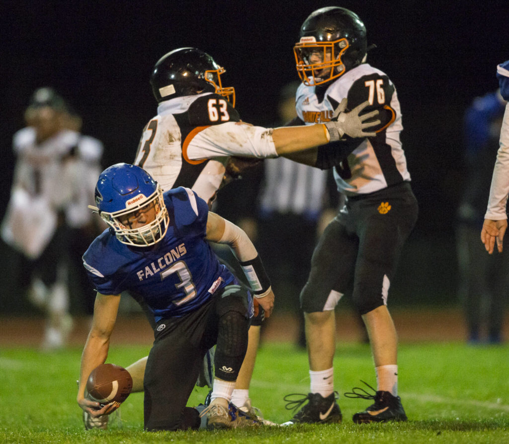 South Whidbey’s Ryan Morgan gets up after being sacked during the game against Granite Falls on Friday, Oct. 29, 2021 in Langley, Wa. (Olivia Vanni / The Herald)
