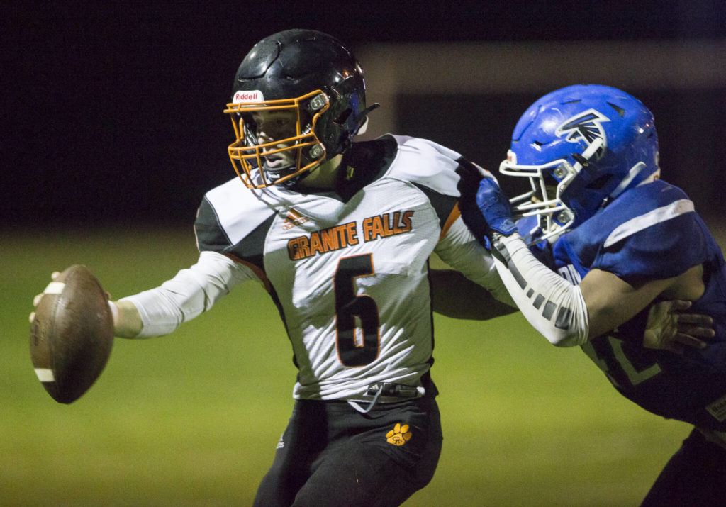 Granite Falls’ Riley Hoople is tackled during the game against South Whidbey on Friday, Oct. 29, 2021 in Langley, Wa. (Olivia Vanni / The Herald)
