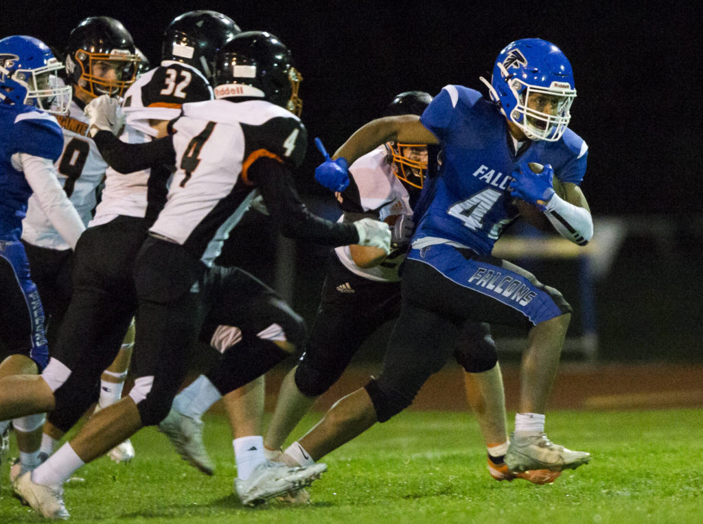 South Whidbey’s Cole Tschetter escapes multiple tackles during the game against Granite Falls on Friday, Oct. 29, 2021 in Langley, Wa. (Olivia Vanni / The Herald)
