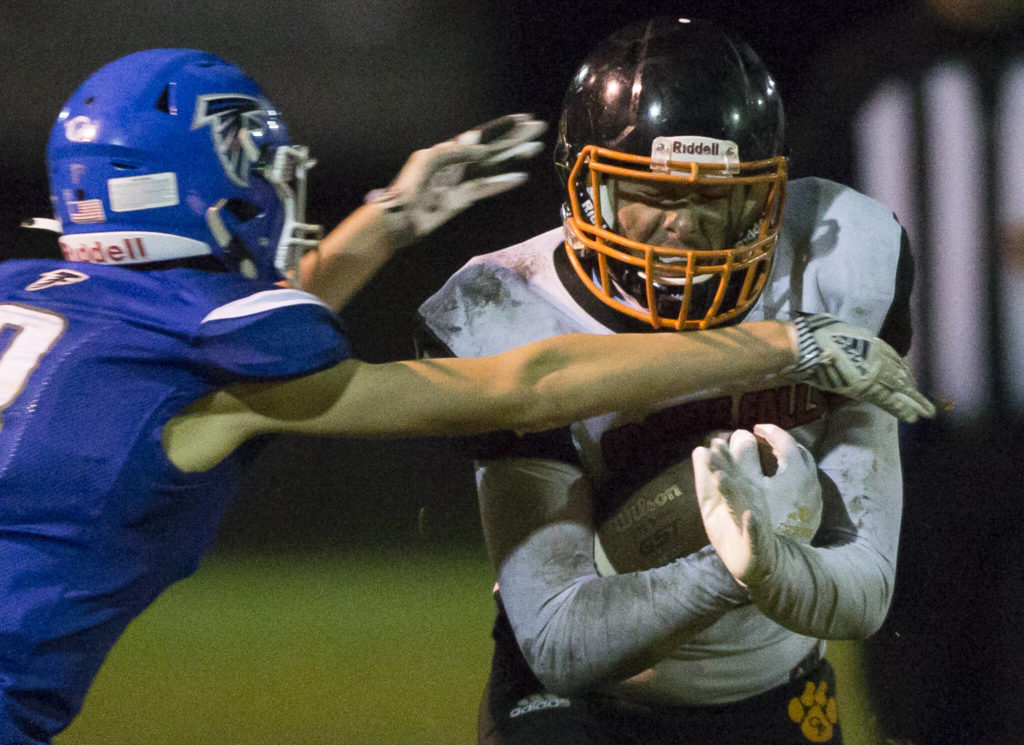 Granite Falls’ Gio Gonzalez is tackled during the game against South Whidbey on Friday, Oct. 29, 2021 in Langley, Wa. (Olivia Vanni / The Herald)
