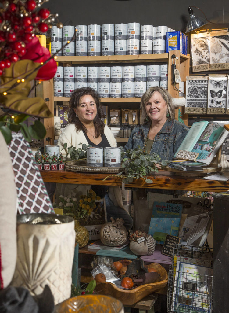 Donna Mains (left) and Kathleen Shalan co-own Country Rose/The Paint Bungalow Home Decor in Arlington. (Andy Bronson / The Herald)
