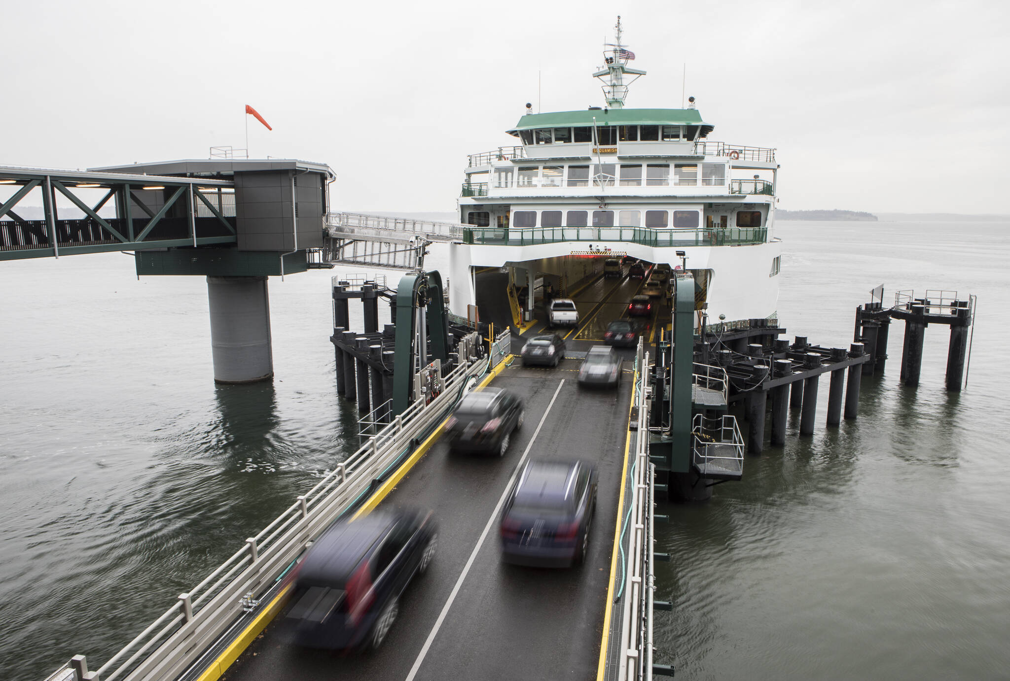 Cars drive onto the ferry at the Washington State Ferries terminal on Monday in Mukilteo. (Olivia Vanni / The Herald)