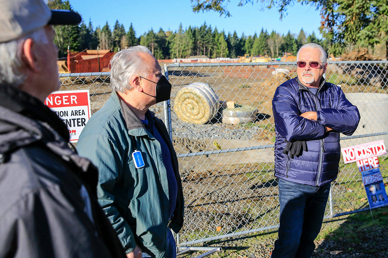 Members of the Livable Lake Stevens, Charles Allen, left to right, David Clay and Doug Turner at the construction of Costco in Lake Stevens on October 31, 2021. (Kevin Clark / The Herald)