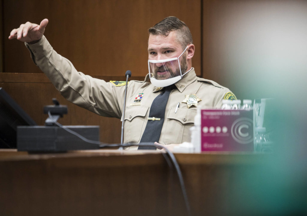 Sheriff’s Deputy Art Wallin testifies during the trial of Kevin Lewis on Wednesday in Everett. (Olivia Vanni / The Herald)
