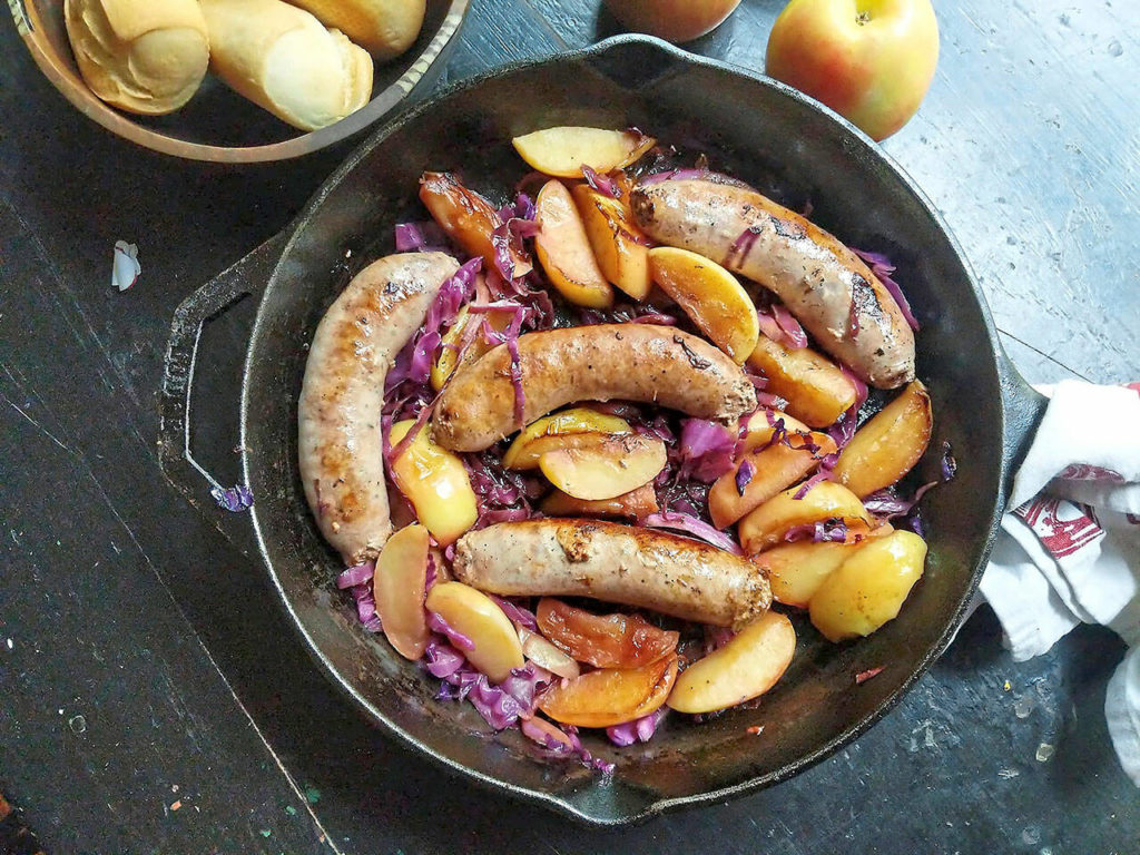 Sweet Italian sausage sizzles in the same pan as sliced apple and red cabbage in this easy skillet recipe. (Gretchen McKay / Pittsburgh Post-Gazette)
