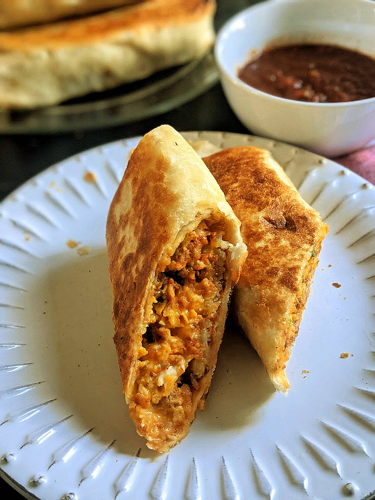 A flour tortilla stuffed with chorizo sausage, scrambled eggs, crispy potatoes and Mexican cheese makes the perfect breakfast-on-the-go. (Gretchen McKay / Pittsburgh Post-Gazette)