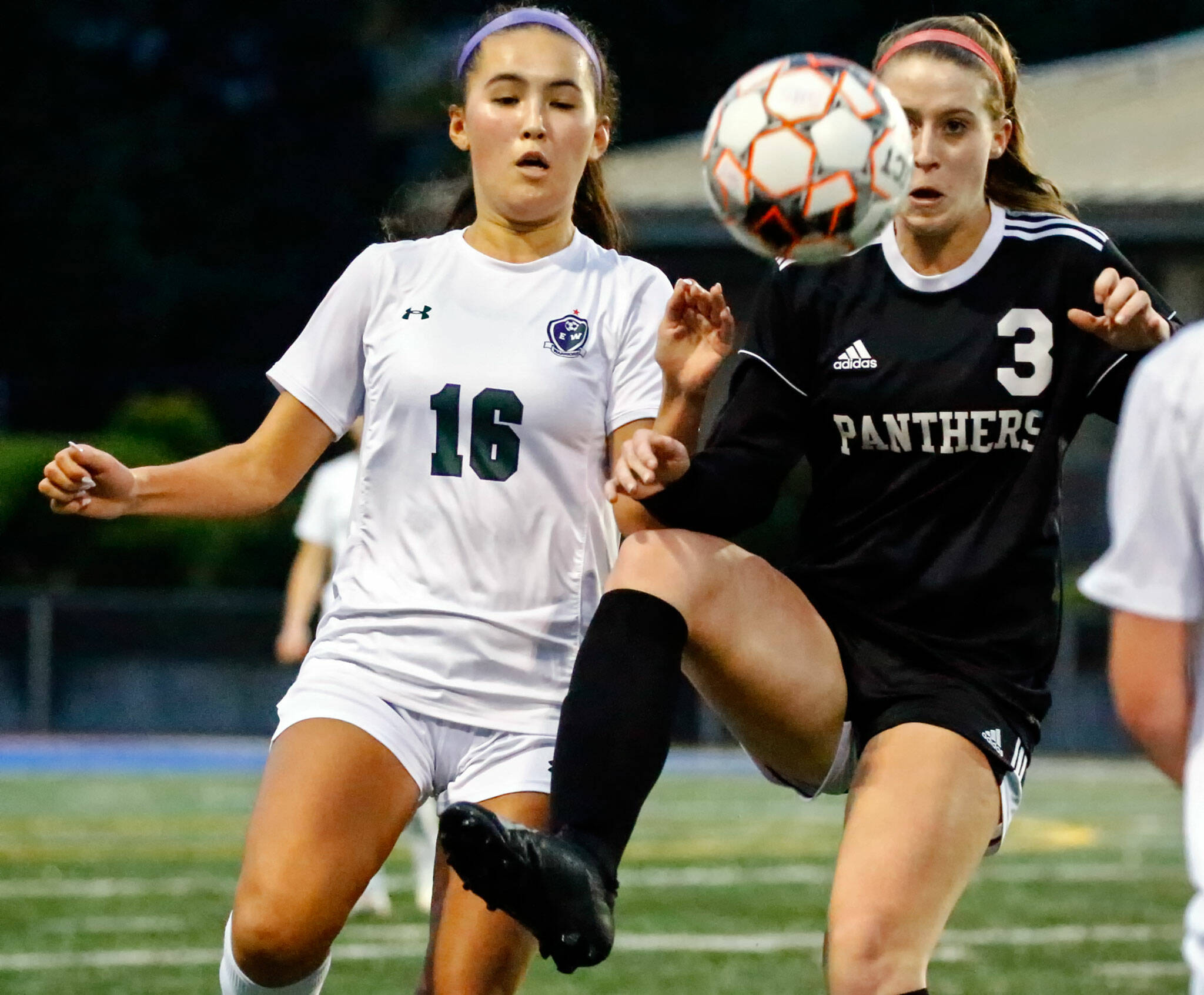 Snohomish’s Sara Rodgers (right) battles for control of the ball during the Panthers’ 2-0 win over Edmonds-Woodway in Tuesday night’s Class 3A District 1 Tournament semifinal. Snohomish clinched a state berth with the victory. (Kevin Clark / The Herald)