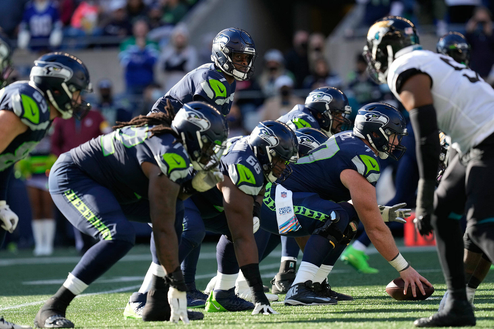 Seahawks quarterback Geno Smith (7) waits for the snap during a game against the Jaguars on Oct. 31, 2021, in Seattle. The Seahawks won 31-7. (AP Photo/Ben VanHouten)