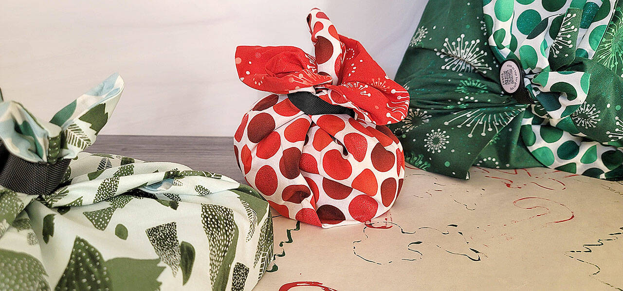 Green your holiday present-wrapping process by choosing reusable fabric and recyclable paper. (Jennifer Bardsley)
