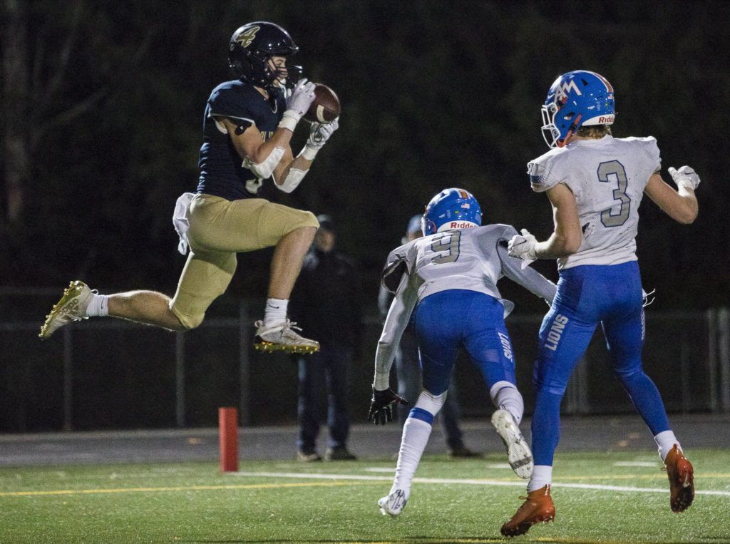 Arlington’s Gage Price catches the ball in the end zone for a touchdown during the game against Auburn Mountainview on Friday, Nov. 5, 2021 in Arlington, Wa. (Olivia Vanni / The Herald)
