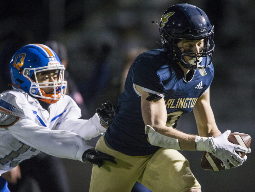 Arlington’s Gage Price reaches for the end zone during the game against Auburn Mountainview on Friday, Nov. 5, 2021 in Arlington, Wa. (Olivia Vanni / The Herald)
