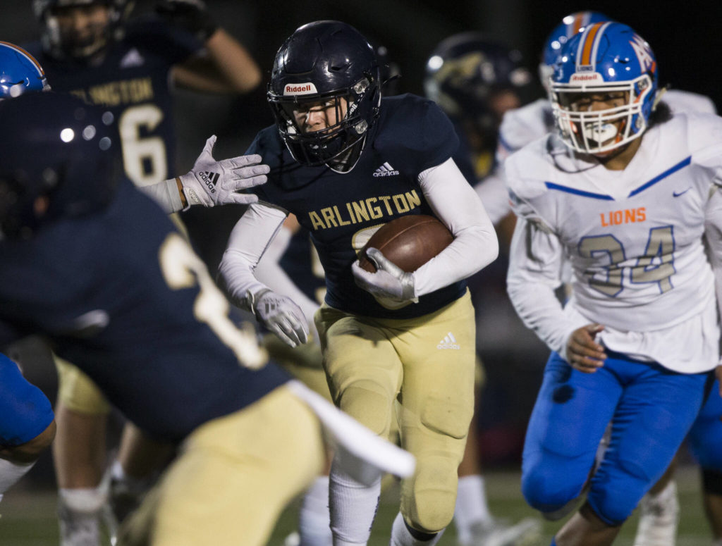 Arlington’s RJ Gese runs the ball during the game against Auburn Mountainview on Friday, Nov. 5, 2021 in Arlington, Wa. (Olivia Vanni / The Herald)
