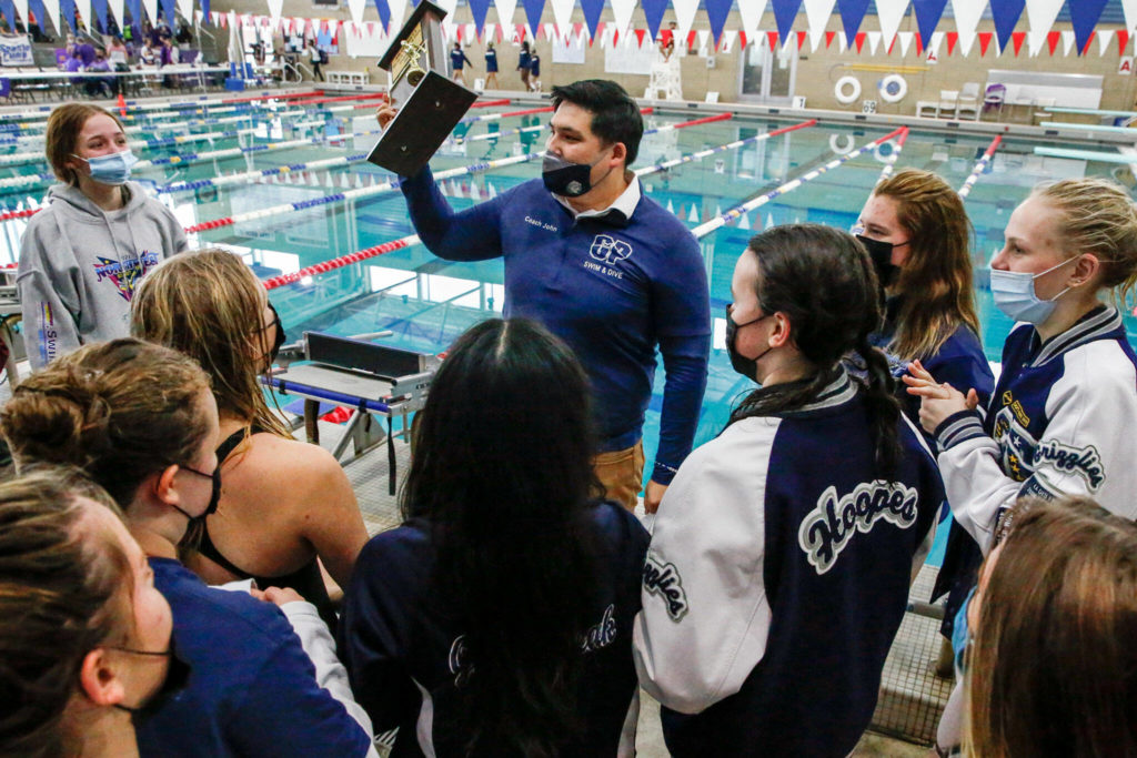 Glacier Peak’s head coach, John Neff, addresses his team after winning the team title during the 4A Districts Championships Saturday afternoon the at the Snohomish Aquatic Center on November 6, 2021. (Kevin Clark / The Herald)
