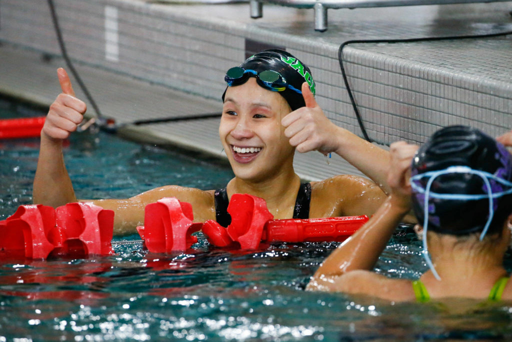 Jackson’s Olivia Hoyla celebrates after the 100 yard breaststroke during the 4A District Championships Saturday afternoon the at the Snohomish Aquatic Center on November 6, 2021. (Kevin Clark / The Herald)
