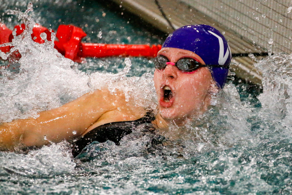 Lake Stevens’ Madelynn Butler reaches the finish in the 50 yard freestyle during the 4A District Championships Saturday afternoon the at the Snohomish Aquatic Center on November 6, 2021. (Kevin Clark / The Herald)
