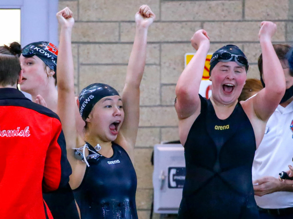 Members of the Snohomish’s 200 yard medley relay team cheer their first place finish in the 3A District Championships Saturday afternoon the at the Snohomish Aquatic Center on November 6, 2021. (Kevin Clark / The Herald)
